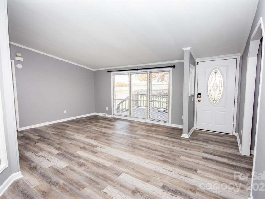 943 Tabor Road, Olin, NC 28660.  MLS# CAR4319811, YatesRealty ID 3609. Living Room and Foyer
