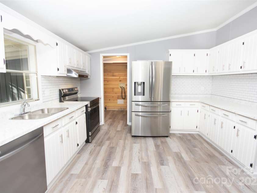 943 Tabor Road, Olin, NC 28660.  MLS# CAR4319811, YatesRealty ID 3609. Well appointed kitchen!