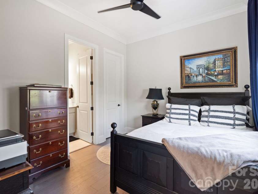 4135 Merkland Lane, Charlotte, NC 28226.  MLS# CAR4401079, YatesRealty ID 36090. Spacious 1st floor guest bedroom with natural light and ceiling fan — ideal for guests, home office or multigenerational living in South Charlotte NC.