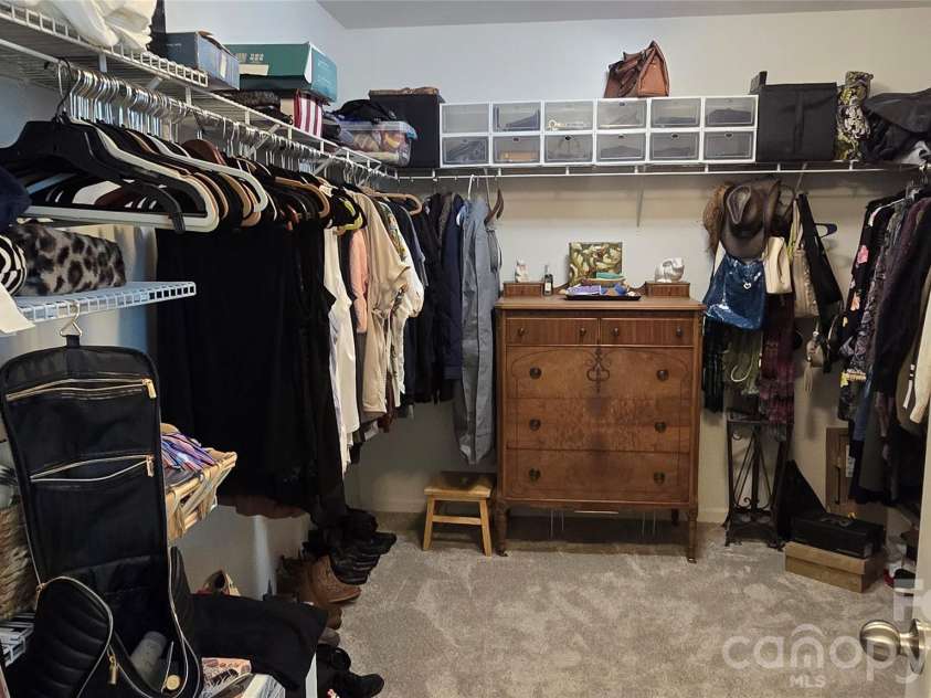 1005 Wainscott Drive, Waxhaw, NC 28173.  MLS# CAR4400196, YatesRealty ID 36092. Owner's Suite Walk-In closet - shelving on three sides!