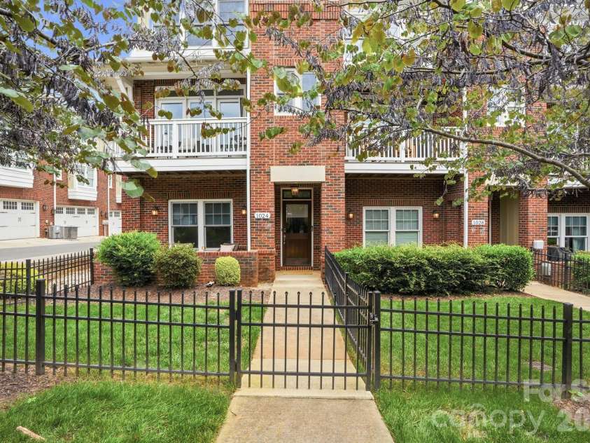 1024 Wesley Park Lane, Charlotte, NC 28208.  MLS# CAR4392665, YatesRealty ID 36096. Front entrance with a fenced-in yard