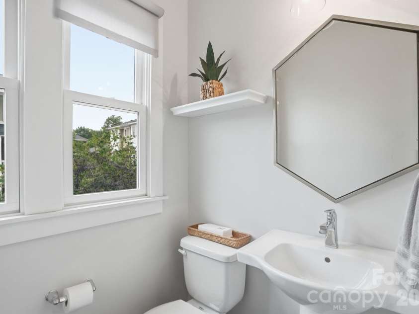 1024 Wesley Park Lane, Charlotte, NC 28208.  MLS# CAR4392665, YatesRealty ID 36096. Powder bath off of living room