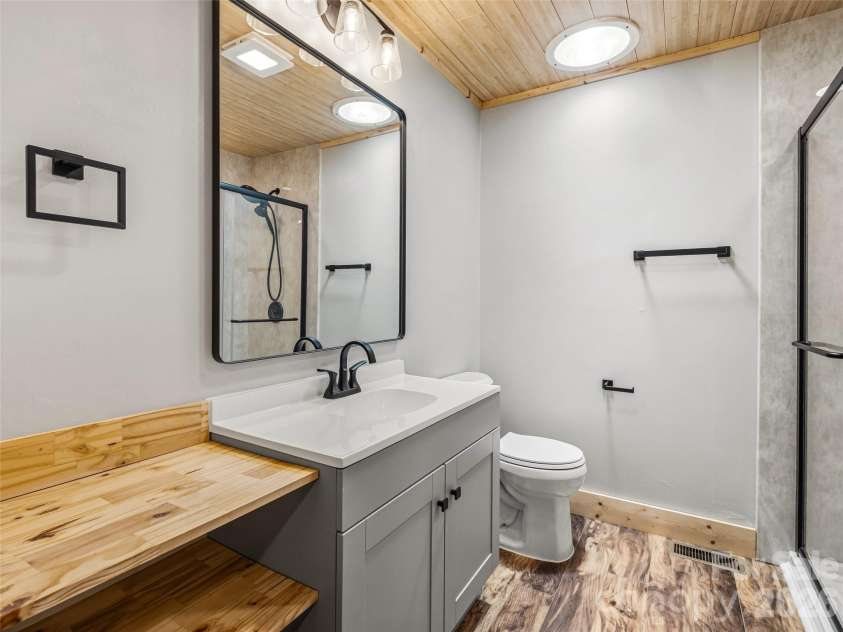 785 Pisgah Forest Drive, Pisgah Forest, NC 28768.  MLS# CAR4397604, YatesRealty ID 36100. Guest bath