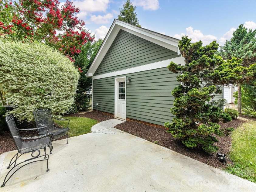 15715 Taviston Street, Huntersville, NC 28078.  MLS# CAR4401975, YatesRealty ID 36105. A detached two-car garage provides secure parking, additional storage, and convenient access from the private patio.
