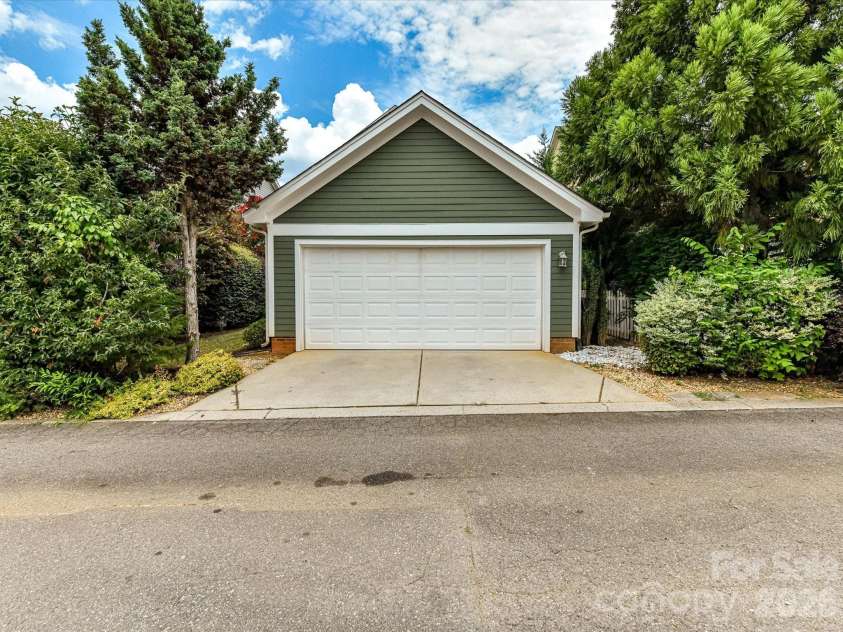 15715 Taviston Street, Huntersville, NC 28078.  MLS# CAR4401975, YatesRealty ID 36105. A detached two-car garage provides secure parking, additional storage, and convenient access from the private patio.