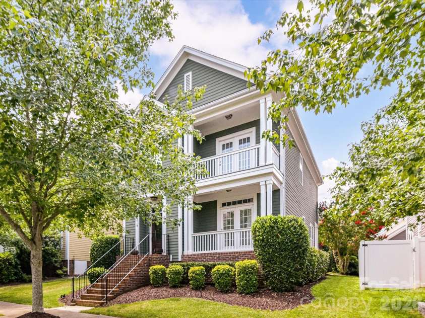 15715 Taviston Street, Huntersville, NC 28078.  MLS# CAR4401975, YatesRealty ID 36105. Classic Southern charm shines from this beautifully landscaped Monteith Park home, where dual covered front porches create an inviting first impression in one of Huntersville's most sought-after communities.