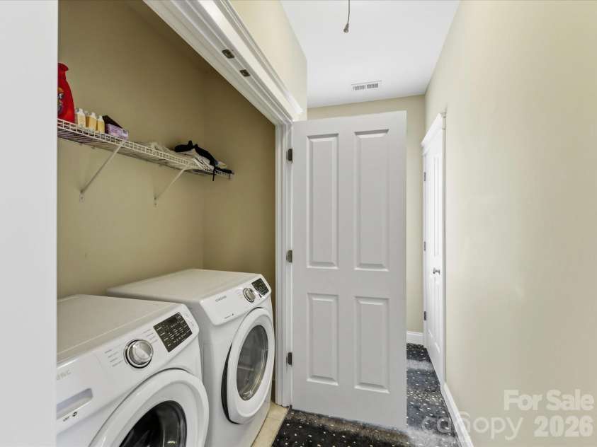 15715 Taviston Street, Huntersville, NC 28078.  MLS# CAR4401975, YatesRealty ID 36105. Convenient upstairs laundry area with built-in shelving keeps everyday chores organized and close to the bedrooms.