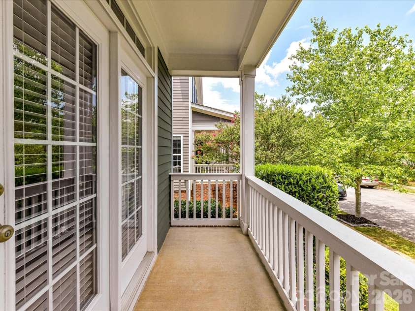 15715 Taviston Street, Huntersville, NC 28078.  MLS# CAR4401975, YatesRealty ID 36105. Enjoy your morning coffee or evening unwind from the private covered balcony overlooking the tree-lined streets and charming surroundings of Monteith Park.