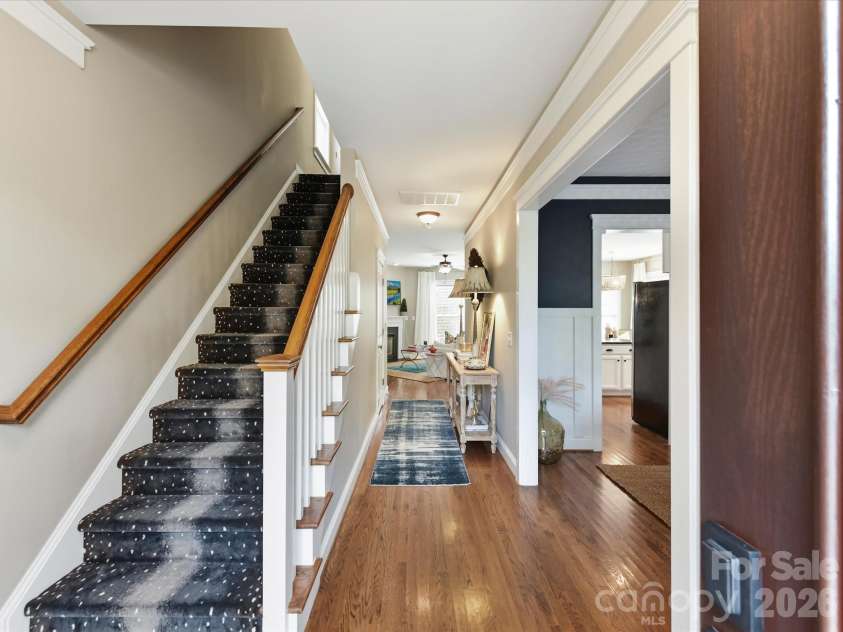 15715 Taviston Street, Huntersville, NC 28078.  MLS# CAR4401975, YatesRealty ID 36105. Step inside to a welcoming foyer featuring rich hardwood floors, elegant trim details, and an abundance of natural light that sets the tone for the home's timeless design.