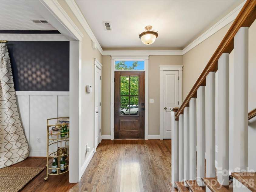 15715 Taviston Street, Huntersville, NC 28078.  MLS# CAR4401975, YatesRealty ID 36105. Step inside to a welcoming foyer featuring rich hardwood floors, elegant trim details, and an abundance of natural light that sets the tone for the home's timeless design.