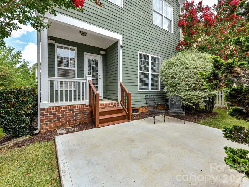 15715 Taviston Street, Huntersville, NC 28078.  MLS# CAR4401975, YatesRealty ID 36105. Step outside to a private patio and covered rear porch, creating the perfect space for outdoor dining, relaxing, or entertaining year-round.