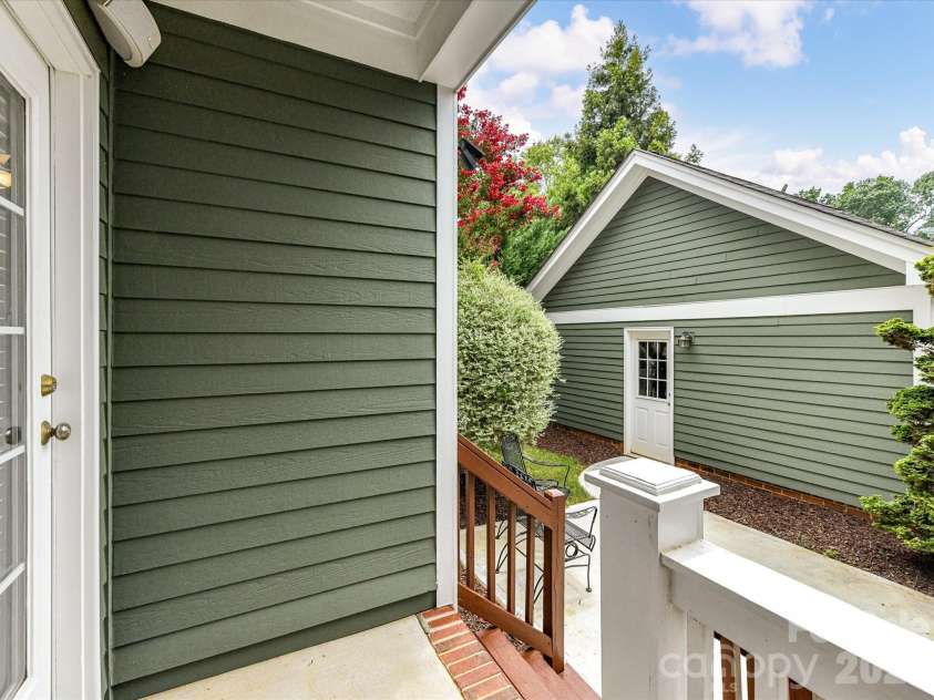 15715 Taviston Street, Huntersville, NC 28078.  MLS# CAR4401975, YatesRealty ID 36105. Step outside to a private patio and covered rear porch, steps away from your 2 car detached garage, creating the perfect space for outdoor dining, relaxing, or entertaining year-round.