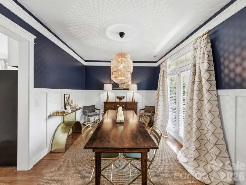 15715 Taviston Street, Huntersville, NC 28078.  MLS# CAR4401975, YatesRealty ID 36105. The spacious formal dining room showcases custom trim details and an abundance of natural light, creating the perfect setting for entertaining.