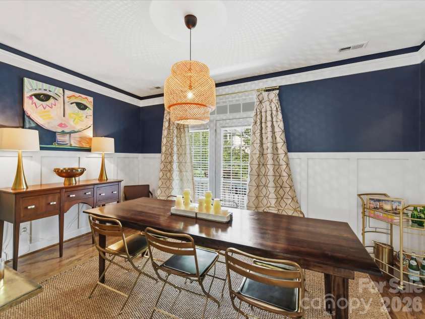 15715 Taviston Street, Huntersville, NC 28078.  MLS# CAR4401975, YatesRealty ID 36105. The spacious formal dining room showcases custom trim details and an abundance of natural light, creating the perfect setting for entertaining.