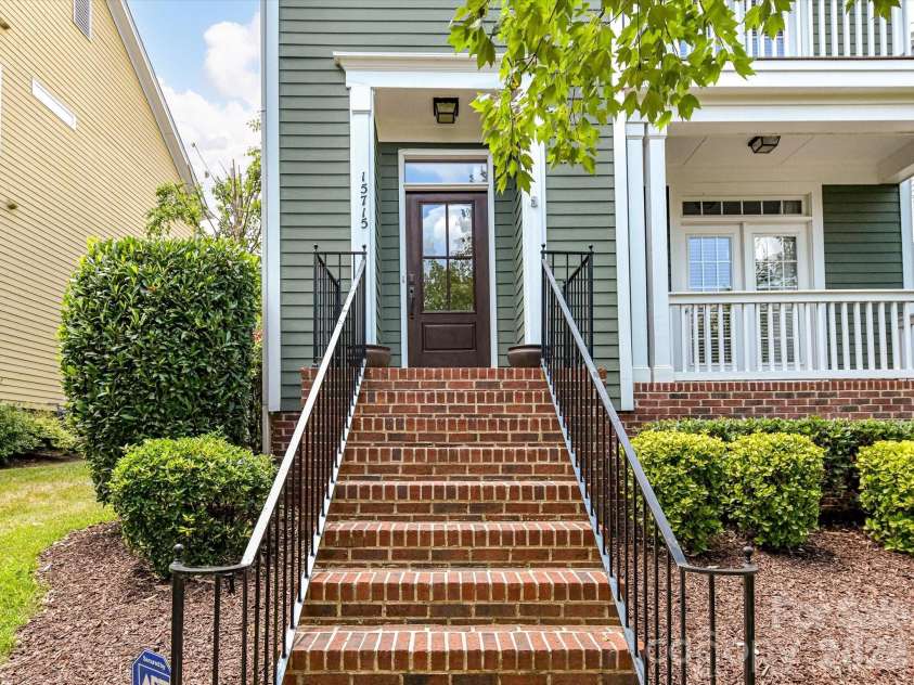 15715 Taviston Street, Huntersville, NC 28078.  MLS# CAR4401975, YatesRealty ID 36105. Thoughtfully maintained and full of charm, this Monteith Park home welcomes you with a classic covered front porch, mature landscaping, and inviting curb appeal.