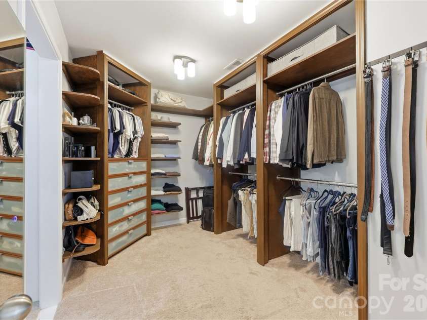 14336 Baytown Court, Huntersville, NC 28078.  MLS# CAR4399744, YatesRealty ID 36107. Custom-designed walk-in closet with extensive built-ins keeps everything beautifully organized.