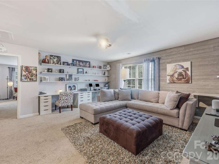 14336 Baytown Court, Huntersville, NC 28078.  MLS# CAR4399744, YatesRealty ID 36107. Loft area featuring dual work stations with custom cabinetry, drawers and corner shelving.