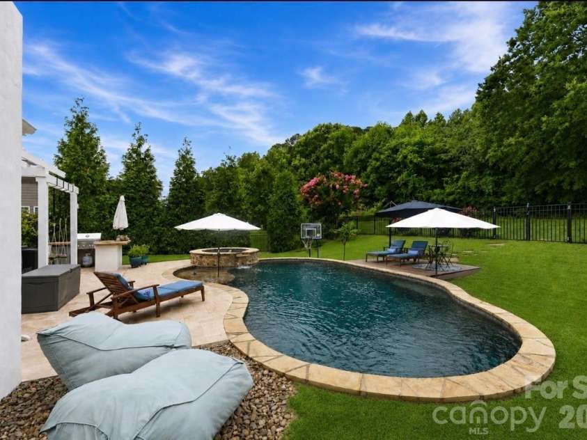 14336 Baytown Court, Huntersville, NC 28078.  MLS# CAR4399744, YatesRealty ID 36107. Premium heated saltwater pool surrounded by lush landscaping creates your own private oasis.