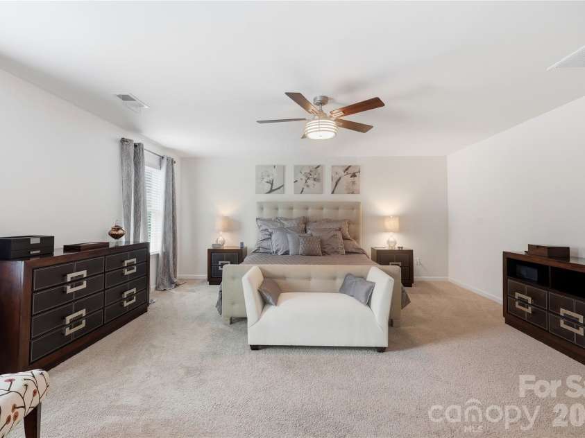 14336 Baytown Court, Huntersville, NC 28078.  MLS# CAR4399744, YatesRealty ID 36107. Spacious primary bedroom offers a peaceful retreat with abundant natural light.