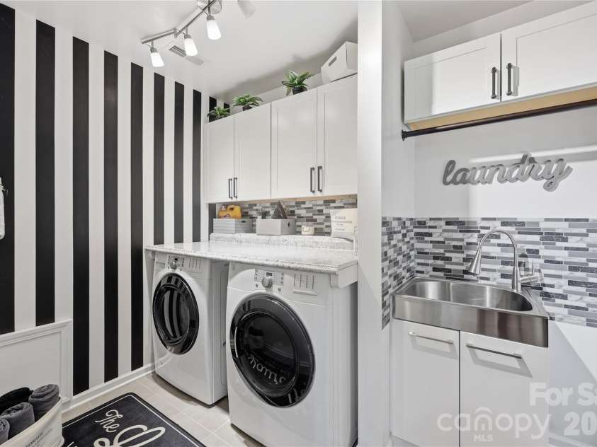 14336 Baytown Court, Huntersville, NC 28078.  MLS# CAR4399744, YatesRealty ID 36107. Stylish laundry room with custom cabinetry, designer finishes and utility sink.
