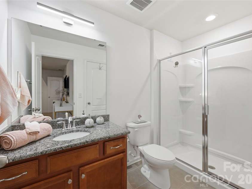14336 Baytown Court, Huntersville, NC 28078.  MLS# CAR4399744, YatesRealty ID 36107. Well-appointed guest bathroom with modern finishes.