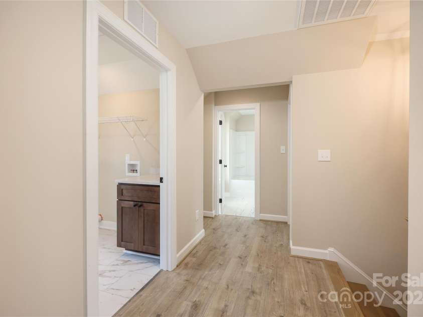 133 Kinney Avenue, Denton, NC 27239.  MLS# CAR4189416, YatesRealty ID 3611. Laundry at top of landing