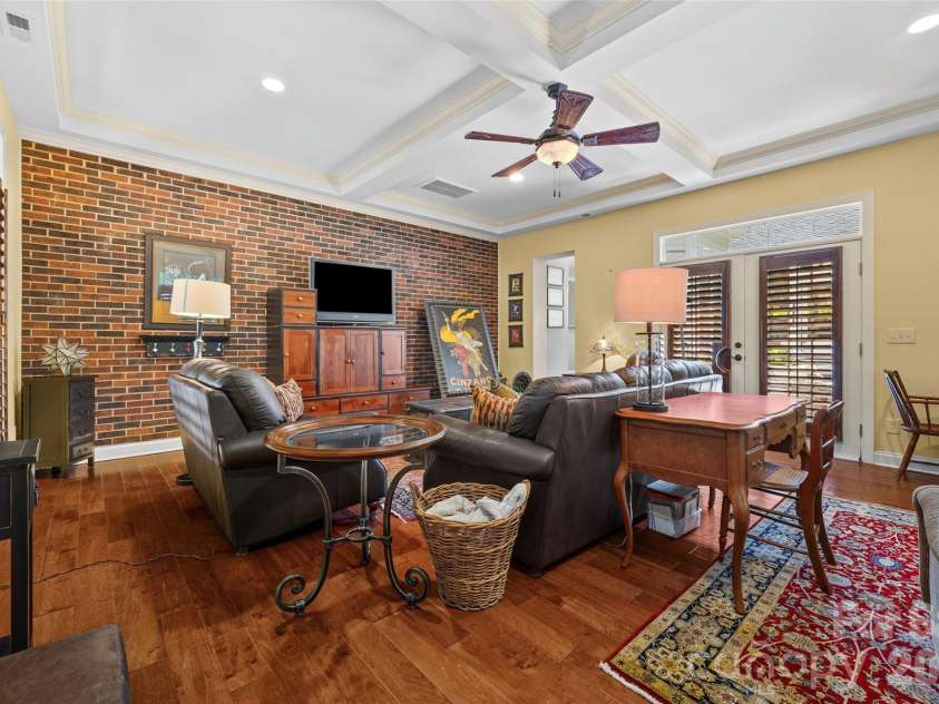 5301 Ravenglass Court, Waxhaw, NC 28173.  MLS# CAR4400032, YatesRealty ID 36114. Large Great Room feature a brick wall accent