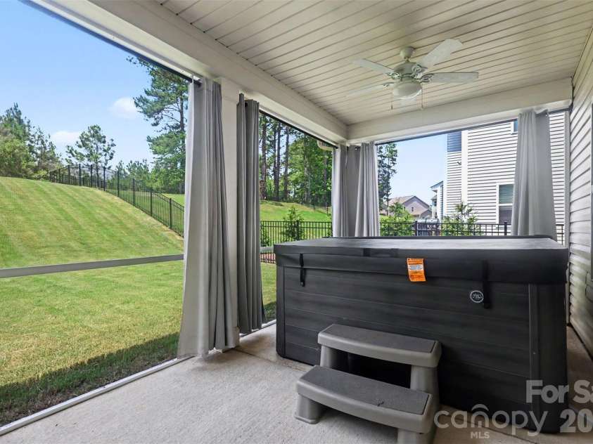 4571 Selhurst Drive, Fort Mill, SC 29707.  MLS# CAR4401865, YatesRealty ID 36119. Covered/Screen porch with Jacuzzi