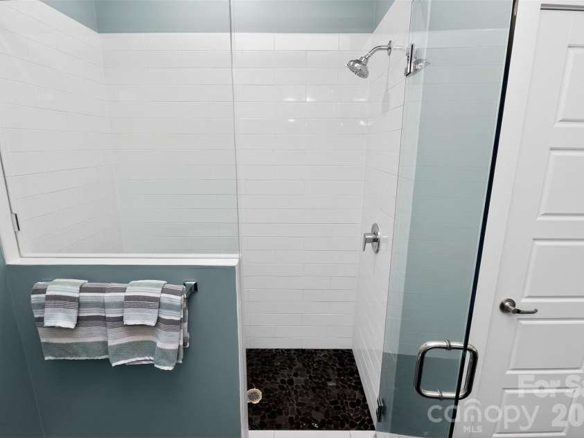 231 Doggett Street, Charlotte, NC 28203.  MLS# CAR4380904, YatesRealty ID 36121. Shower in primary