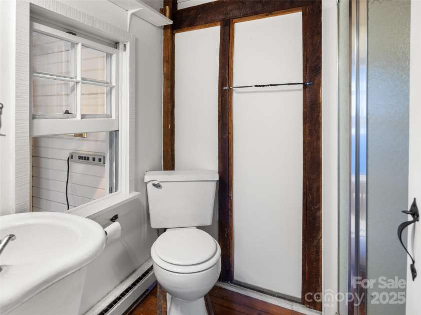 255 & 257 Crescent Street, Saluda, NC 28773.  MLS# CAR4218749, YatesRealty ID 3613. Barn 2nd bathroom, off of primary bedroom suite.