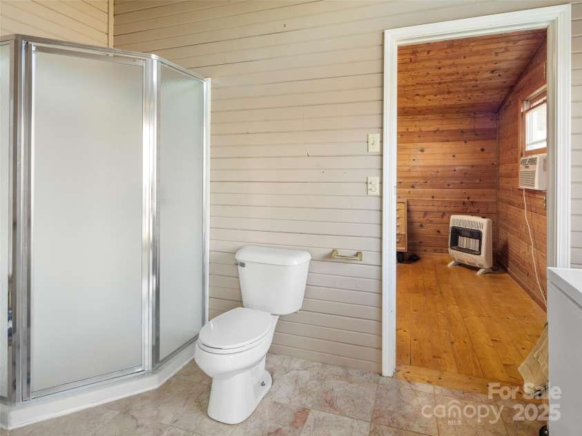 255 & 257 Crescent Street, Saluda, NC 28773.  MLS# CAR4218749, YatesRealty ID 3613. Barn house 3rd bedroom. Has glass patio doors to back covered deck.