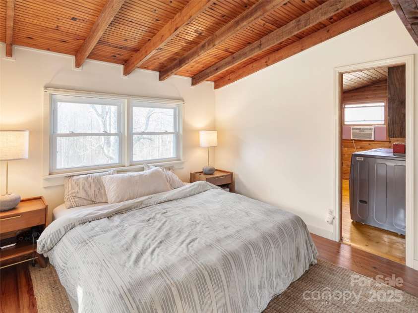 255 & 257 Crescent Street, Saluda, NC 28773.  MLS# CAR4218749, YatesRealty ID 3613. Barn house primary bedroom suite. (2022)