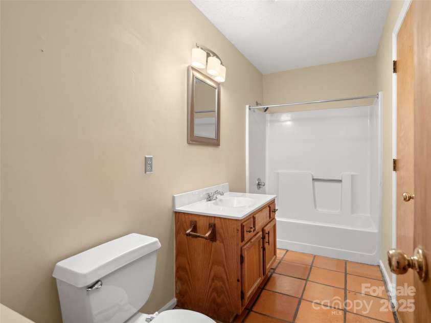 255 & 257 Crescent Street, Saluda, NC 28773.  MLS# CAR4218749, YatesRealty ID 3613. Bathroom in 257 Crescent