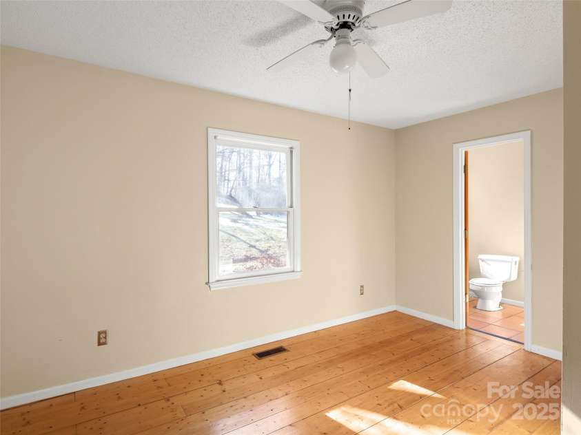 255 & 257 Crescent Street, Saluda, NC 28773.  MLS# CAR4218749, YatesRealty ID 3613. Bedroom 1 with bathroom attached