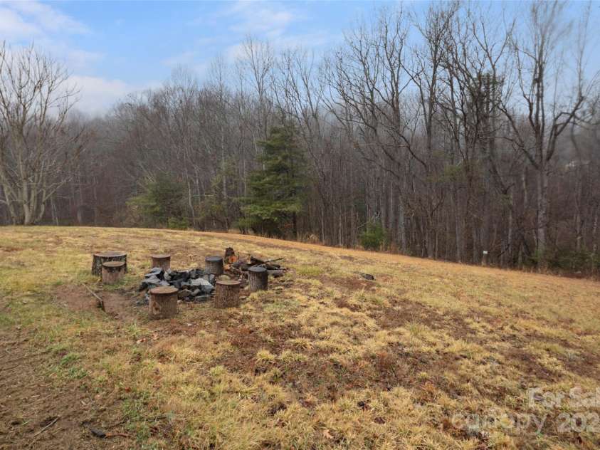 255 & 257 Crescent Street, Saluda, NC 28773.  MLS# CAR4218749, YatesRealty ID 3613. Starry nights! The woods are your neighbors. Wide open spaces and big views. Sit around the fire and take in the beauty and privacy.