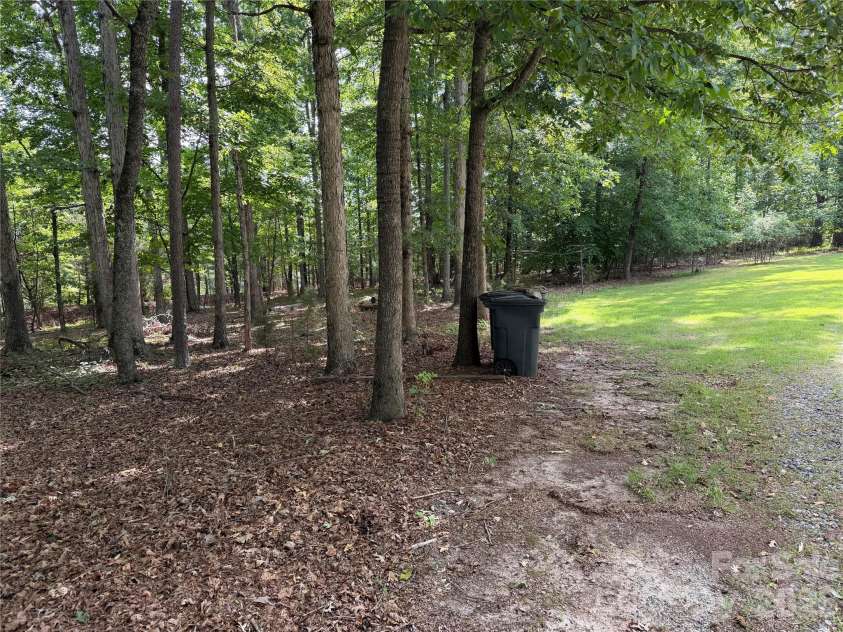 556 Gilbert Road, Columbus, NC 28722.  MLS# CAR4402949, YatesRealty ID 36145. Level Wooded area
