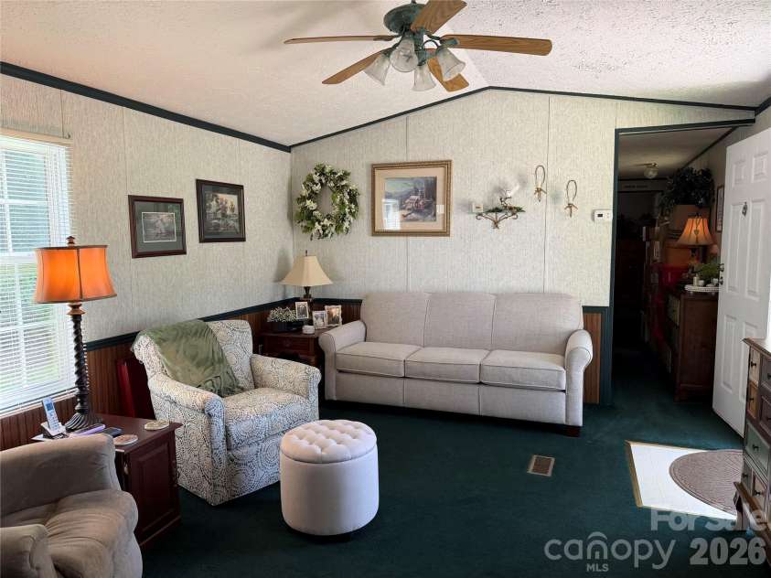 556 Gilbert Road, Columbus, NC 28722.  MLS# CAR4402949, YatesRealty ID 36145. Living Room with vaulted ceiling