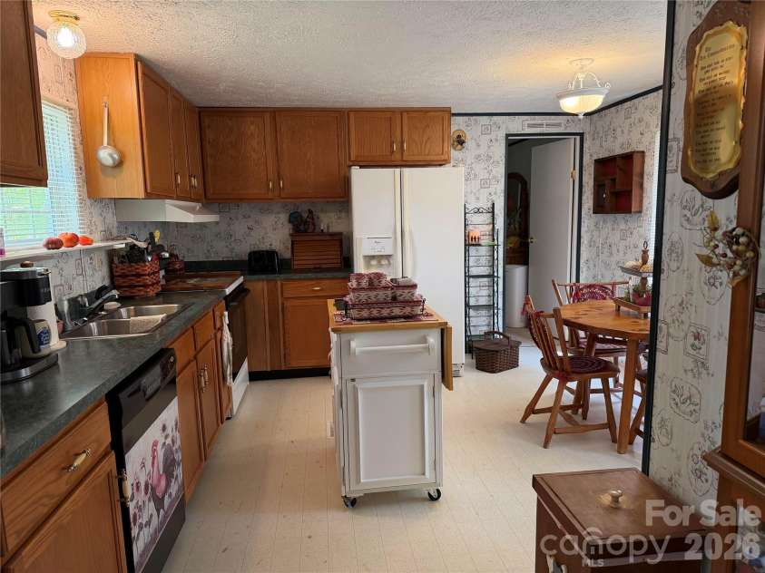 556 Gilbert Road, Columbus, NC 28722.  MLS# CAR4402949, YatesRealty ID 36145. Open Kitchen/Dining Area