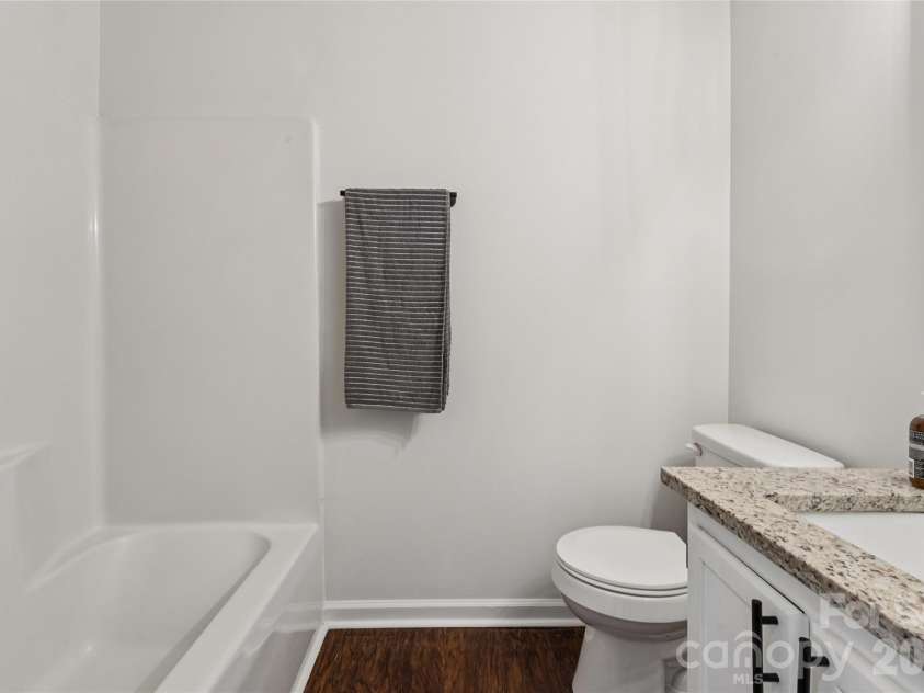 1620 Arlyn Circle, Charlotte, NC 28213.  MLS# CAR4400699, YatesRealty ID 36164. Renovated bathroom featuring durable luxury vinyl plank flooring and modern hardware updates.