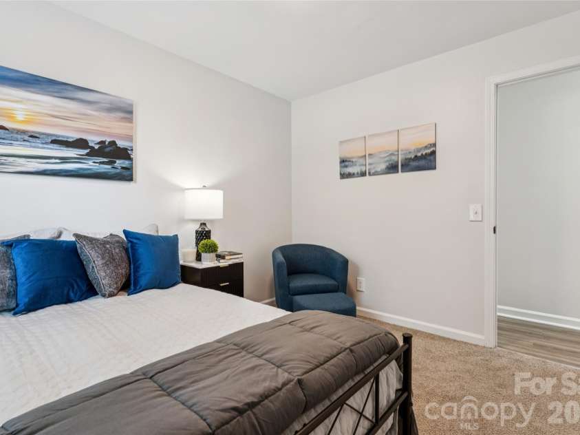 1638 Arlyn Circle, Charlotte, NC 28213.  MLS# CAR4400700, YatesRealty ID 36165. First bedroom featuring ample natural light and newly installed window treatments that will convey with the property. This space is situated conveniently down the hallway and offers a bright, inviting atmosphere.