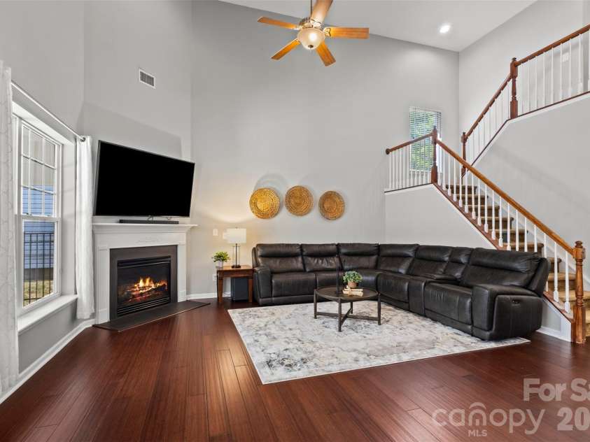 13406 Centennial Commons Parkway, Huntersville, NC 28078.  MLS# CAR4399839, YatesRealty ID 36168. The heart of the home - open concept, light filled, and complete with a cozy corner gas log fireplace.