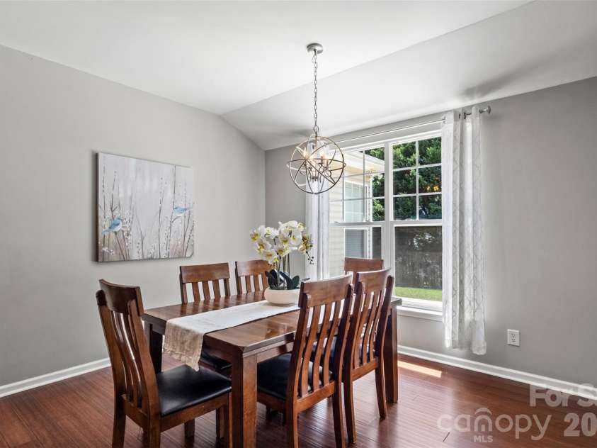 13406 Centennial Commons Parkway, Huntersville, NC 28078.  MLS# CAR4399839, YatesRealty ID 36168. The large dining area off the kitchen overlooks the peaceful backyard and the door leads to the cozy screeened in porch.
