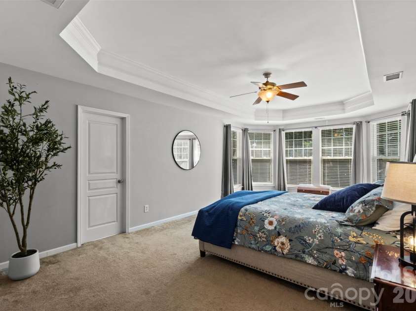 13406 Centennial Commons Parkway, Huntersville, NC 28078.  MLS# CAR4399839, YatesRealty ID 36168. The wall of windows overlooking the tree lined backyard transform your daily routine into a peaceful retreat.