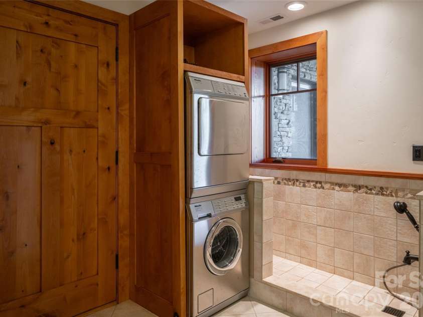4900 Preserve Road, Sylva, NC 28779.  MLS# CAR4393548, YatesRealty ID 36172. Dog wash and second laundry room on lower level. second garage makes this a perfectly reasonable in law suite option