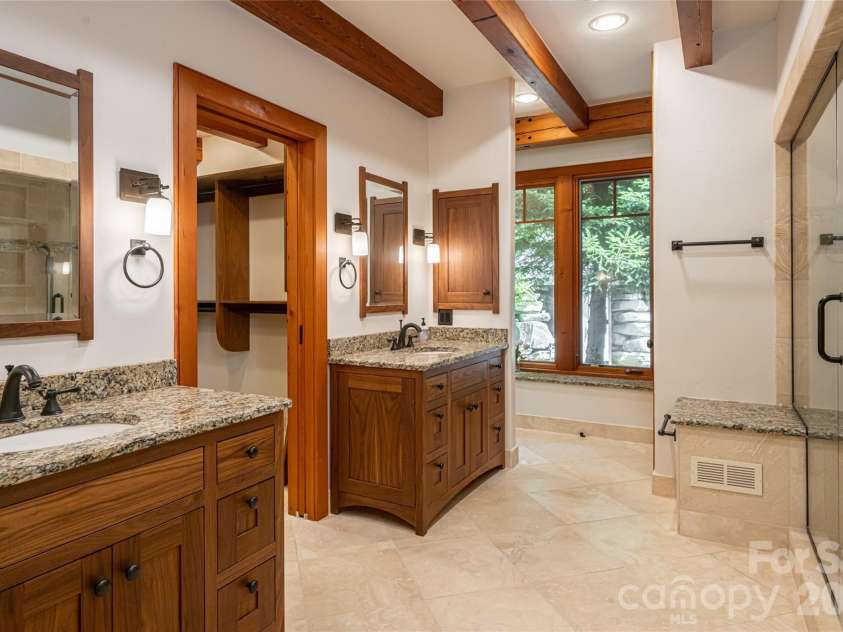 4900 Preserve Road, Sylva, NC 28779.  MLS# CAR4393548, YatesRealty ID 36172. Double vanities, oversized walkin closet, steam shower and his and her water closets make this primary bath a true gem