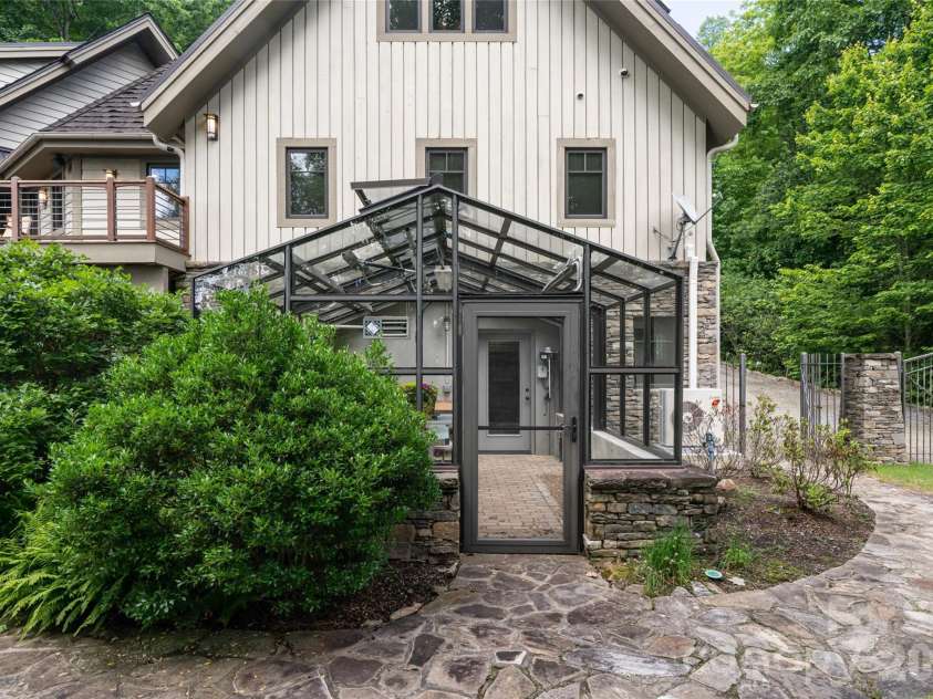 4900 Preserve Road, Sylva, NC 28779.  MLS# CAR4393548, YatesRealty ID 36172. Greenhouse from the lower level view- accessible via lower garage as well