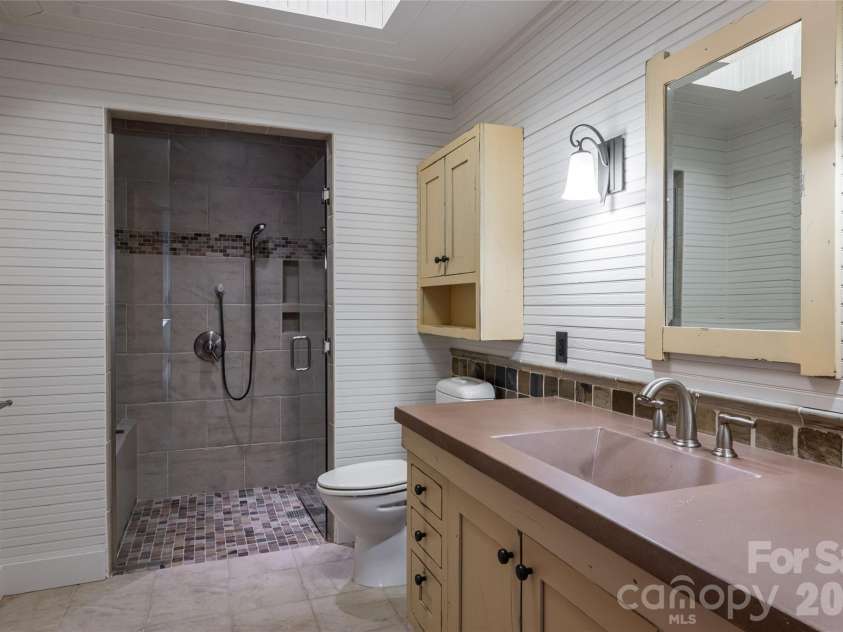 4900 Preserve Road, Sylva, NC 28779.  MLS# CAR4393548, YatesRealty ID 36172. Lower level guest suite