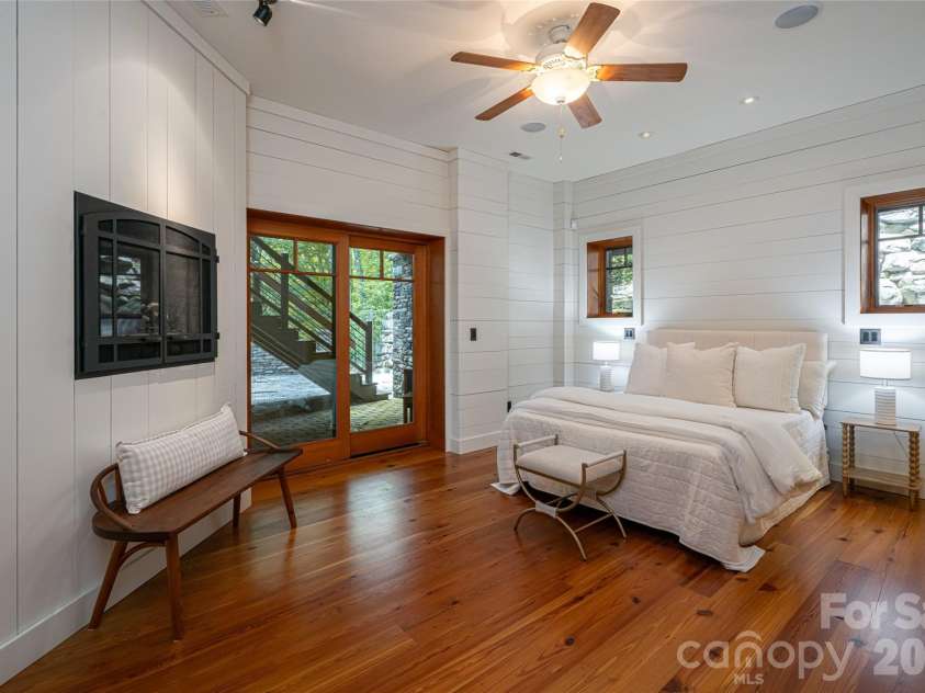 4900 Preserve Road, Sylva, NC 28779.  MLS# CAR4393548, YatesRealty ID 36172. Lower level guest suite with private patio access and heatilator fireplace