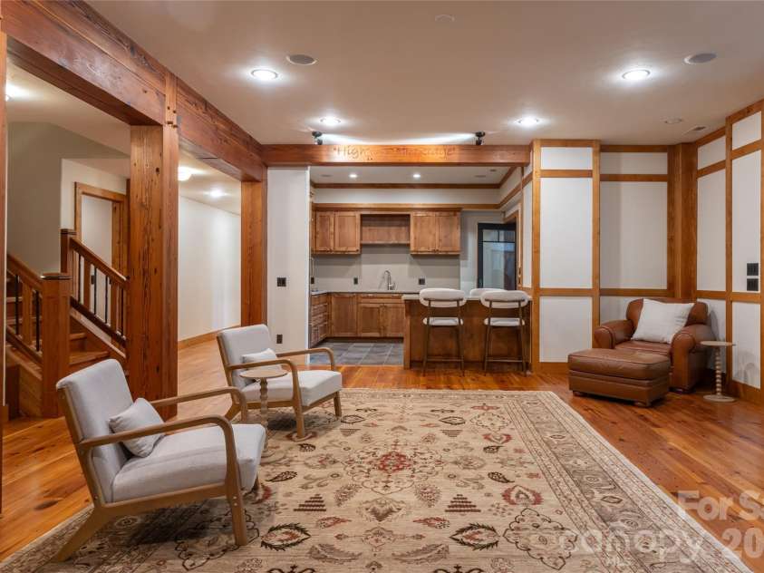 4900 Preserve Road, Sylva, NC 28779.  MLS# CAR4393548, YatesRealty ID 36172. Lower level living room