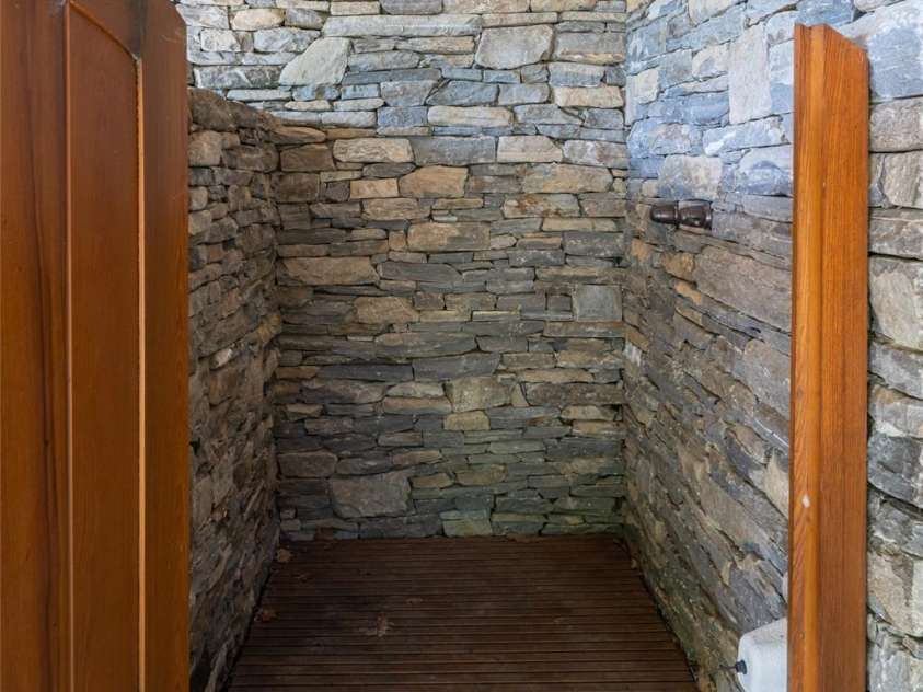4900 Preserve Road, Sylva, NC 28779.  MLS# CAR4393548, YatesRealty ID 36172. Outdoor shower on lower level for the perfect spa experience after a sauna session
